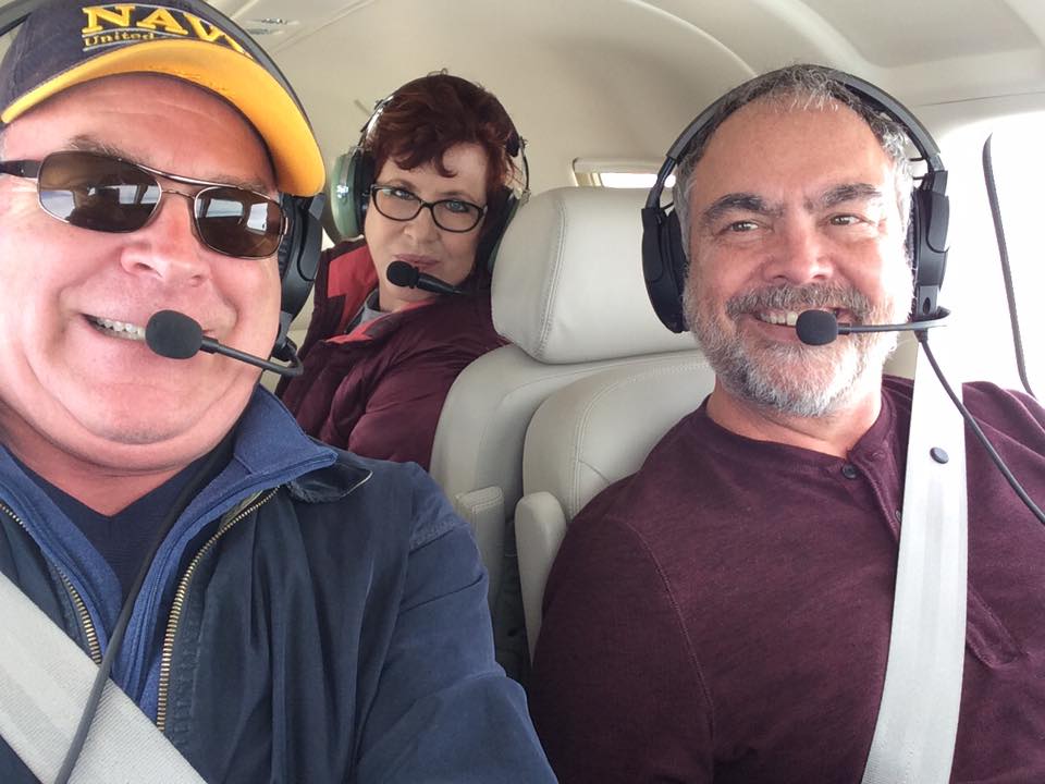 Aviation Training Management LLC with three people on the plane