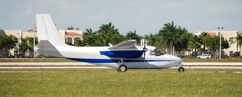 A small plane sitting on top of an airport runway.